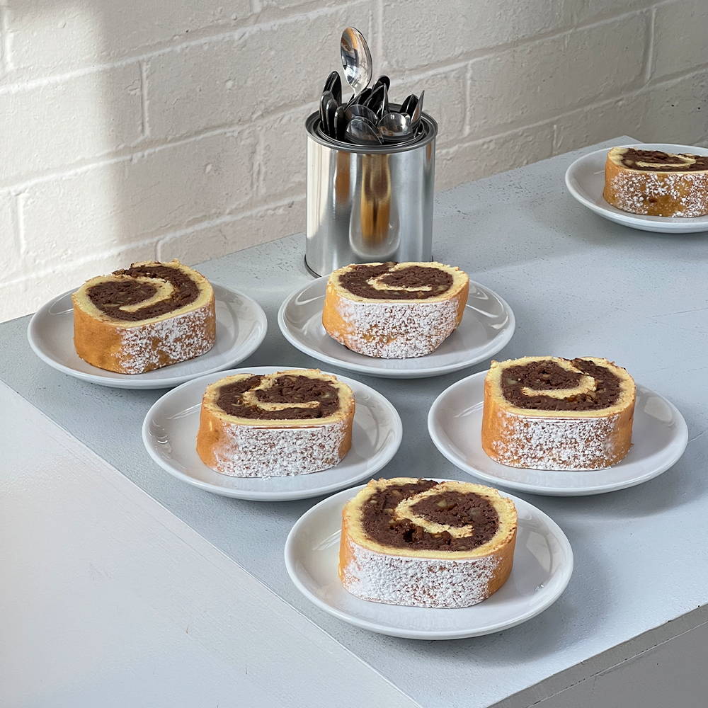 Peaches La Creme's Swiss Roll with Salted Chocolate Cream and Candied Walnuts