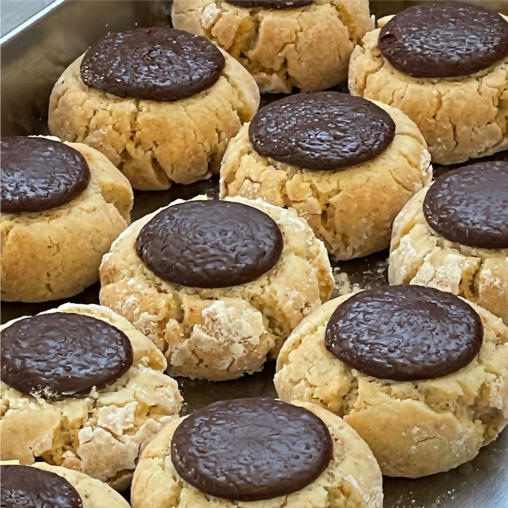 Amaretti with a chocolate button pressed in
